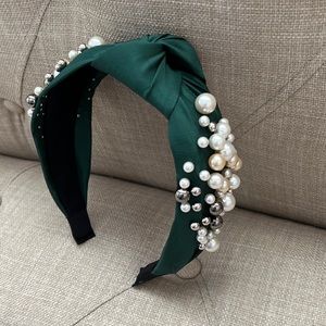 Green headband with pearl embellishments